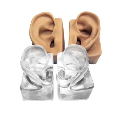 Silicone Demonstration Ears showing beige and clear pairs